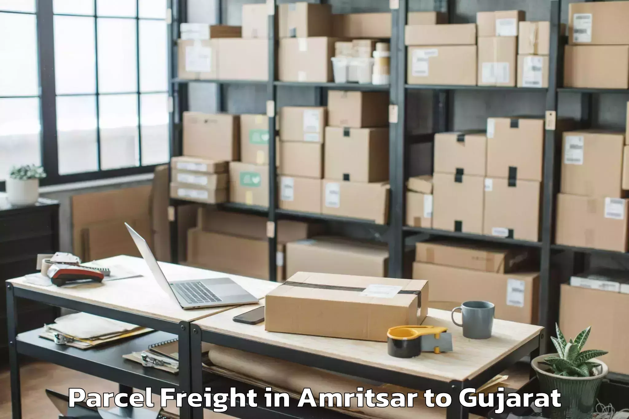 Top Amritsar to Palladium Ahmedabad Parcel Freight Available